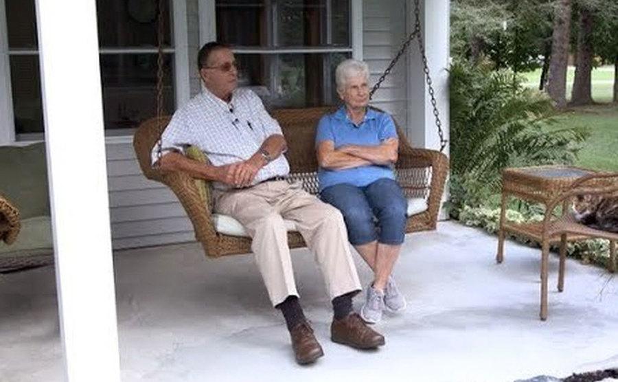 Jerry and Marge are sitting on their front porch. 