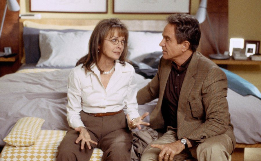 Diane Keaton and Warren Beatty sit in bed in a scene from Town & Country.