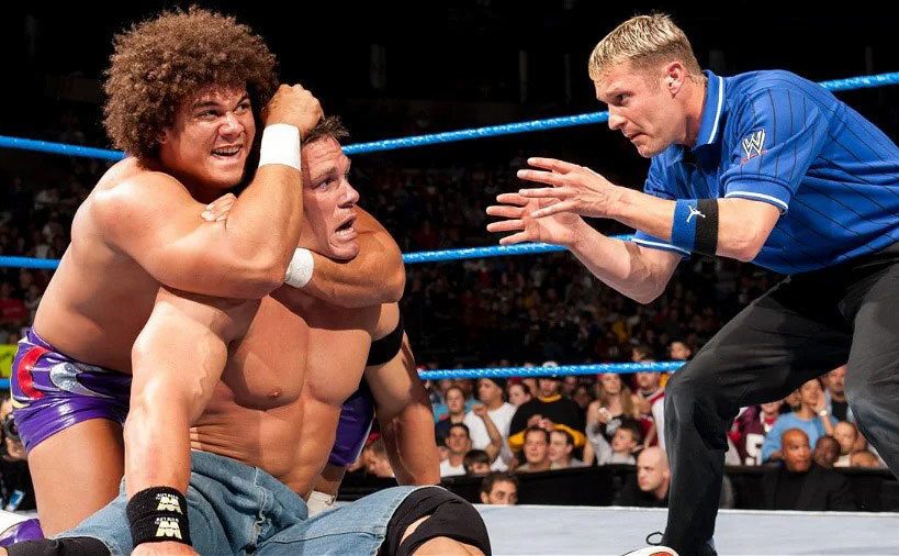 John Cena is pinned under Carlito Caribbean Cool. 
