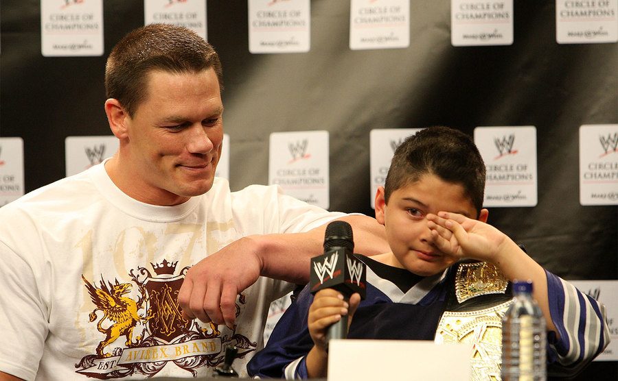 John Cena and a kid named Max, speaks at the WWE and Make-A-Wish event. 