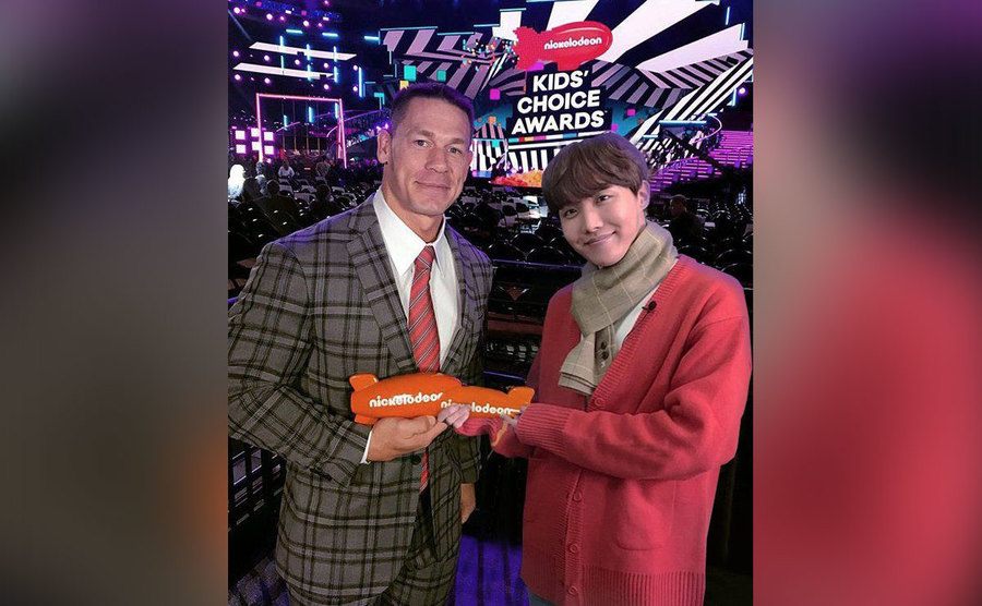 John Cena poses with JHope from BTS. 