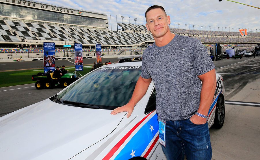 John Cena poses with the pace car prior to the NASCAR Sprint Cup Series. 