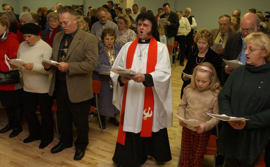A photo of Rev Dorian Baxter conducting a service.