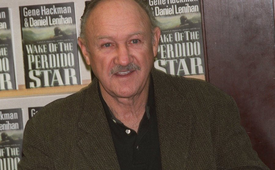 A photo of Hackman during the signing of his first novel.