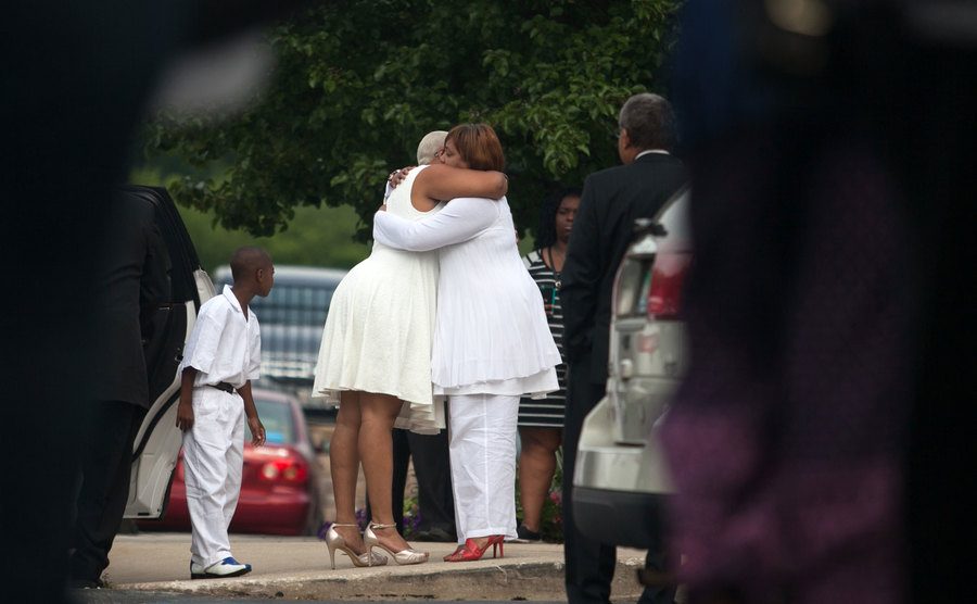 The sister of Sandra Bland is embraced before Sandra’s funeral.