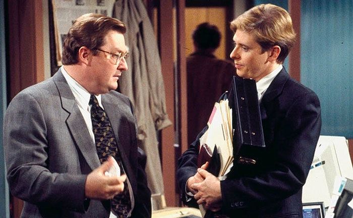 Stephen Root and Dave Foley in a still from NewsRadio. 