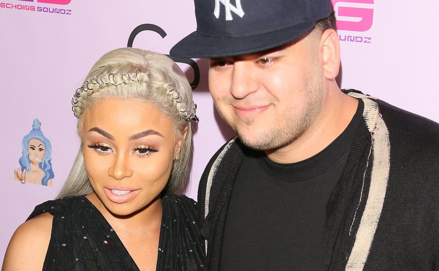 A photo of Blac Chyna and Rob posing for the press.