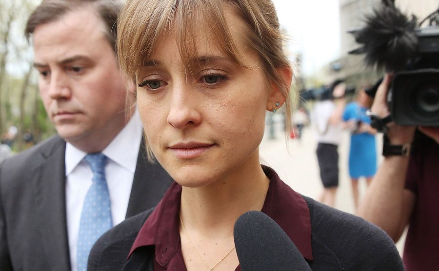 A photo of Allison Mack leaving the courthouse.
