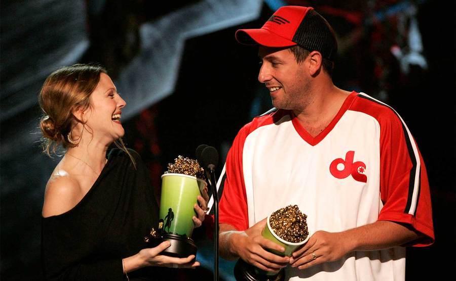 Drew Barrymore and Adam Sandler on stage at the MTV Movie Awards. 