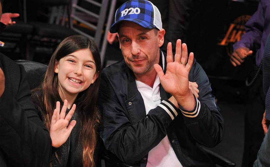 Adam Sandler and daughter Sunny Madeline Sandler attend a basketball game. 