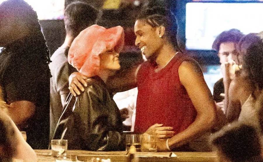 Rocky and Rihanna are out at a bar. 