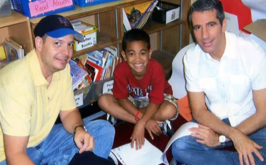 A photo of Peter and Danny with their son at school.