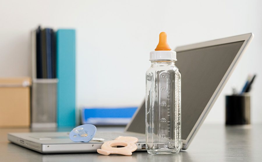 An image of a baby bottle on a desk.