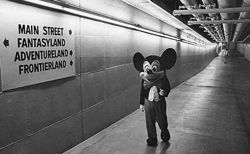 Mickie Mouse walks through the underground tunnels. 