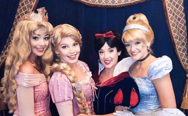 A group of Disneyland Princesses pose together. 