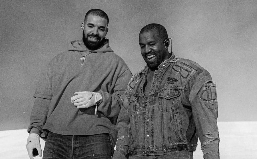Drake and Kanye pose for a photo. 