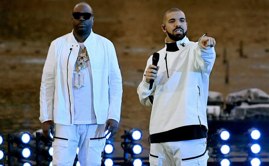 Baka and Drake get ready to perform on stage. 