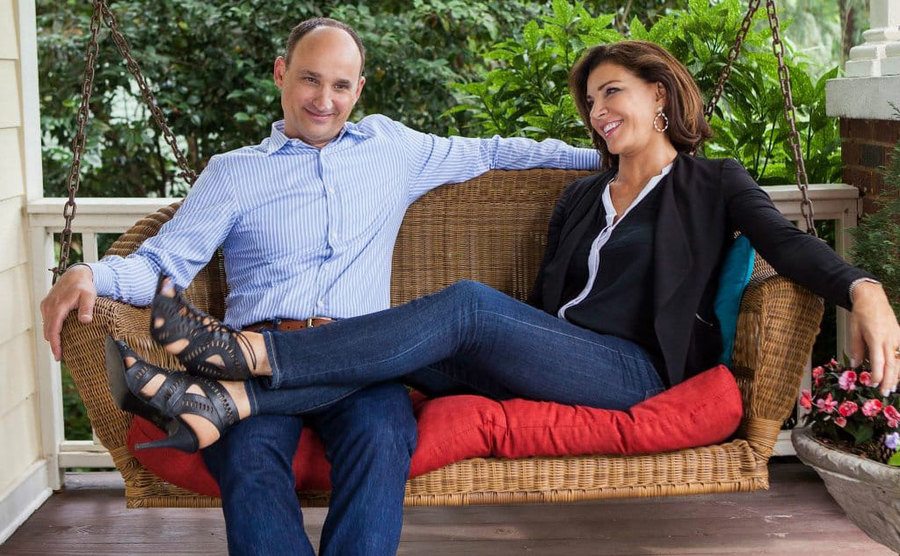 David Visentin and Hilary Farr relax on the front porch. 